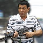 Duterte poses with automatic weapon