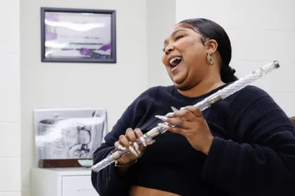 Lizzo playing crystal flute
